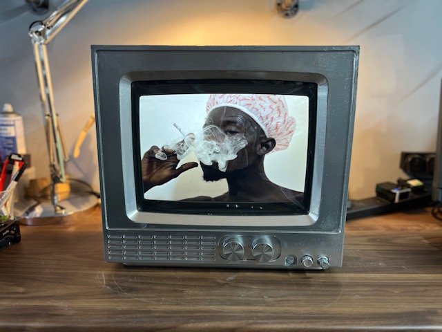 Grey retro CRT television playing video content for hire