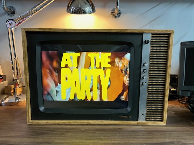 Wood retro television for hire playing branded party video