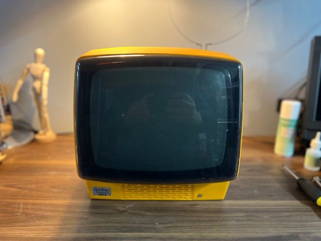 Yellow retro television for hire - colourful 1980s CRT TV prop