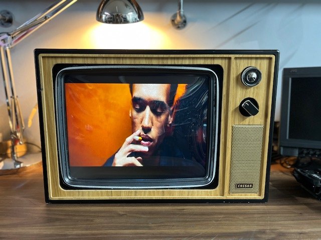 Wood cabinet retro CRT TV to hire playing music video