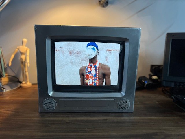 Vintage grey retro television playing video to hire