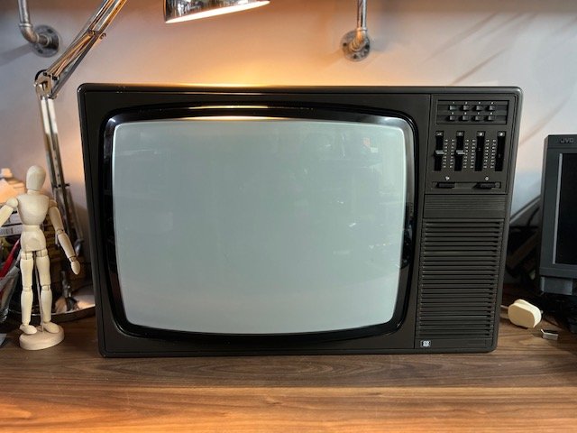 Large black and wood vintage CRT TV for hire with top control panel