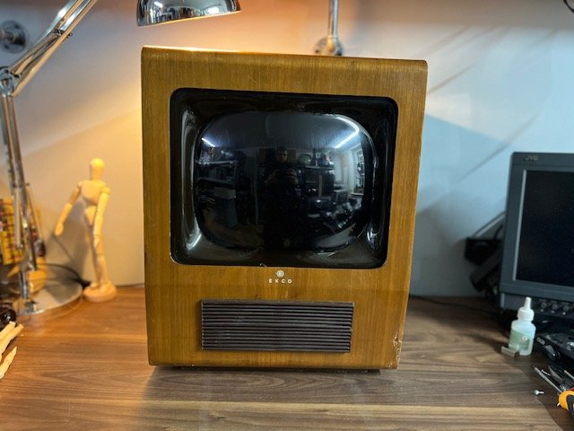 1970s space-age wood vintage TV with rounded screen to hire