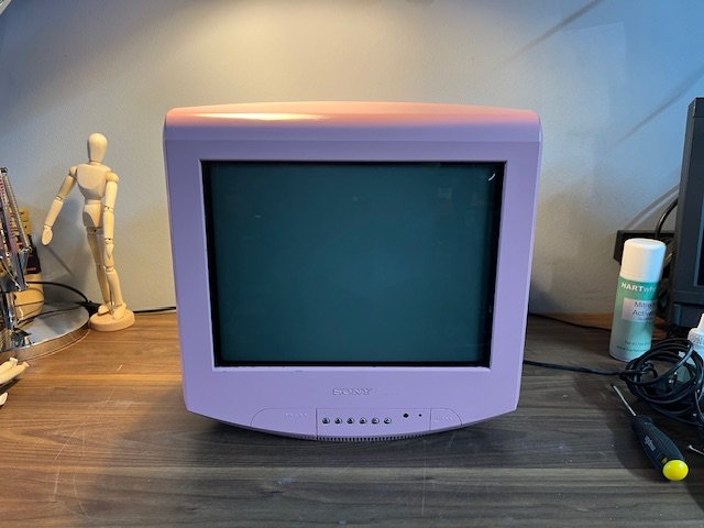 Lilac retro portable CRT television for hire - colourful 1990s TV