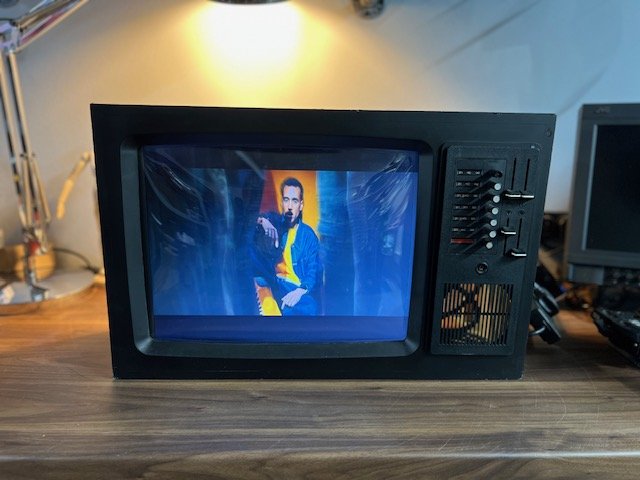 Black retro CRT television for hire playing music video